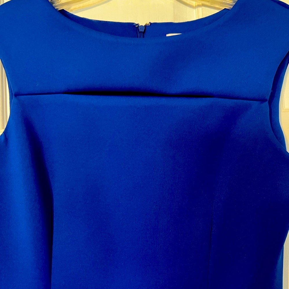 Calvin Klein sleeveless royal blue dress with peek a boo slit above cleavage.